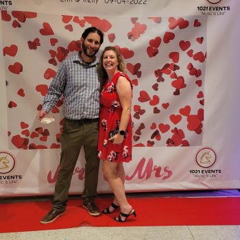 Photo Backdrop Couple posing at a custom 1021 Events photo booth backdrop