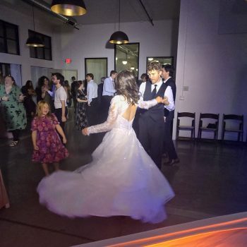 Bride and groom dancing together at their wedding reception