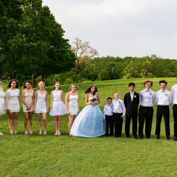 Outdoor wedding party portrait with bride and groom